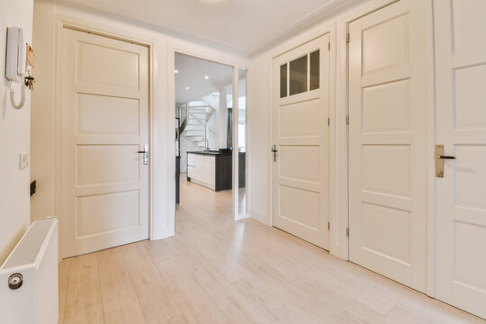 Modern home interior with white doors and hallway