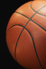 Basketball ball on a black background close-up blur, sports background