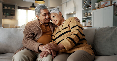Senior, couple and hug for empathy on sofa with support, grief and comfort in living room of house....