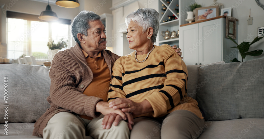 Poster Senior, couple and hug for empathy on sofa with support, grief and comfort in living room of house. Old people, man and woman with love and embrace for security, compassion and sympathy on couch