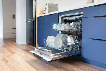 Dishwasher in modern blue kitchen