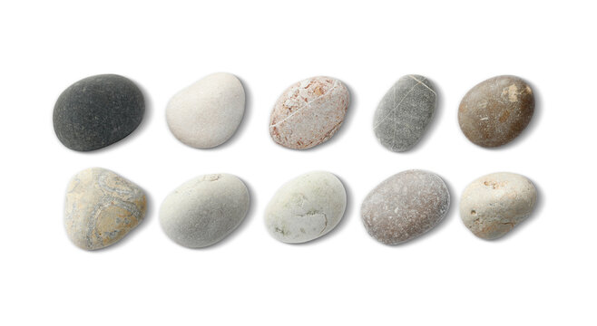 Sea pebbles. Different stones isolated on white, top view