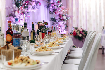 table with food and drinks at wedding banquet