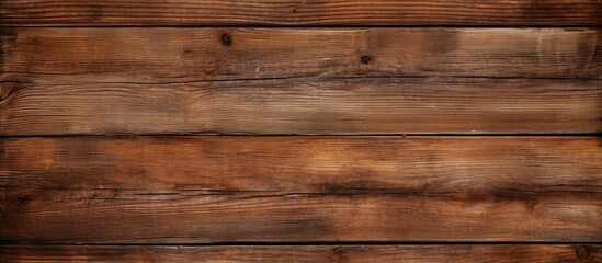 A close up of a brown hardwood plank flooring, showcasing a grainy texture with a varnish finish. The rectangle pattern creates a warm beige tone