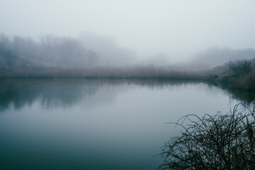 Fog and lake . Frost on lake . Blue morning . Fogy morning . Forest and lake . Trees on the lake . Blue water . Mystery nature . Landscape with fog . Morning at winter . Blue houre 