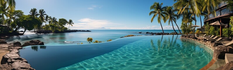Panoramic view of beautiful tropical beach with palm trees and swimming pool