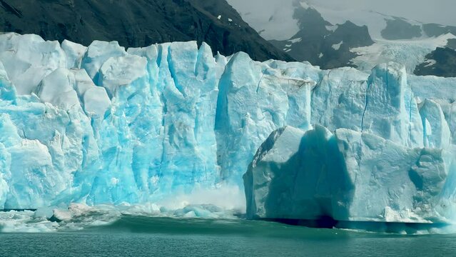 Huge piece of ice cracked and fell in the water at Perito Moreno glacier in Argentinian Patagonia