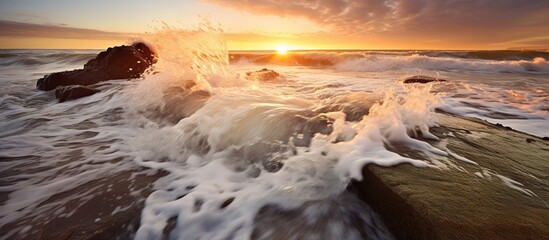 Beautiful seascape with waves and rocks at sunset. Long exposure.