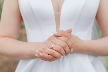bride holds hands on wrist