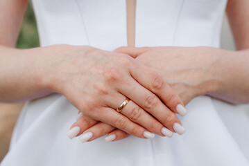 bride holds hands on wrist