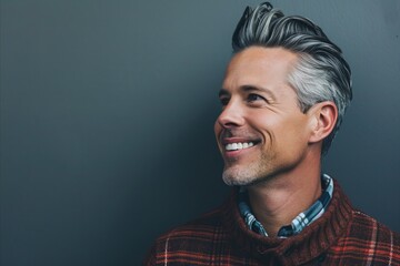 Portrait of a handsome smiling man in checkered shirt. - obrazy, fototapety, plakaty