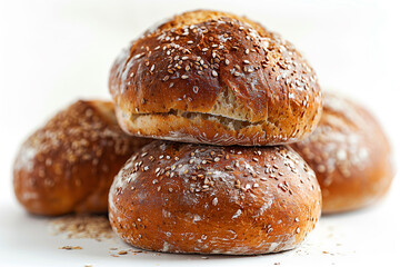 Heap of buns with sesame seeds on white background.