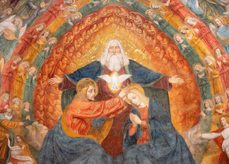 MILAN, ITALY - MARCH 8, 2024: The central part of  fresco of Coronation of Virgin Mary in the apse of Basilica di San Simpliciano by  Ambrogio da Fossano detto il Bergognone (1453 – 1523).