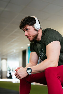 Young Man During Workout Break at Fitness Center