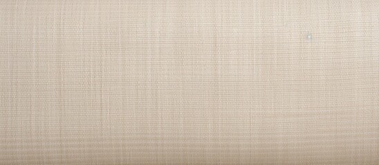 Fototapeta premium A close up of a brown rectangle of striped pattern on beige fabric, resembling wood flooring. The tints and shades of peach create a symmetrical design