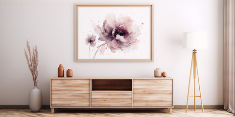 Pink watercolor flower painting in a wooden frame above a mid-century modern credenza with a vase and a tripod lamp beside it.