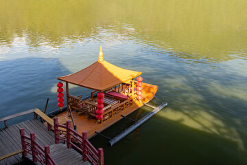 Chinese style tourist transport boat at Rak Thai Village Mae Hong Son, Thailand
