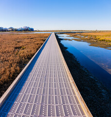Raised Boardwalk Over Saltwater Marsh at Leonabelle Turnbull Birding Center, Port Aransas, Texas,...