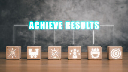 Achieve results concept, Wooden block on desk with achieve results icon on virtual screen.