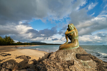 a sculpture of Songkhla Golden Mermaid at Samila Beach, Songkhla, Thailand.