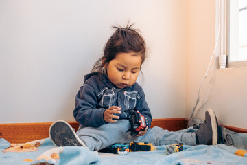 child playing with cars at home - fun concept