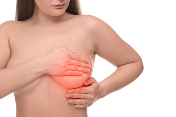 Naked young woman suffering from breast pain on white background, closeup