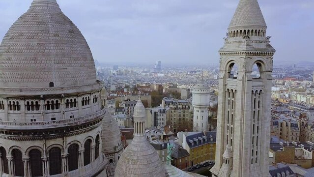 Basilica of the Sacred Heart of Paris and Montmartre aerial view flying close