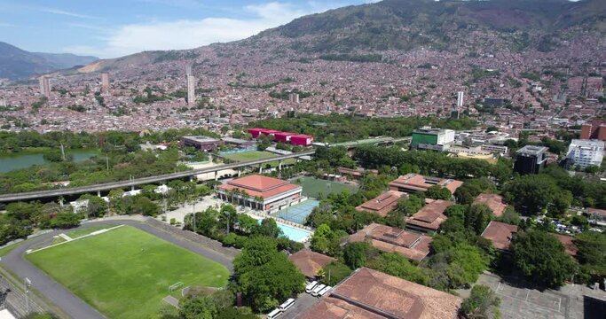 Medellin, Colombia. Aerial View of University Buildings, Explora Park, Metro Railway in Northern Neighborhood, Drone Shot