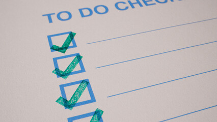 9 photo of to do checklist with green stamp checkmarks on white paper