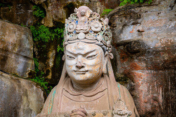 Fototapeta na wymiar Buddha statue portrait in Dazu rock carving, Chongqing, China