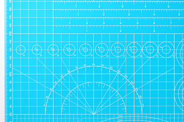 blue cutting mat board on white background with line and scale measure guide pattern for object art design, tool equipment of diy craft work