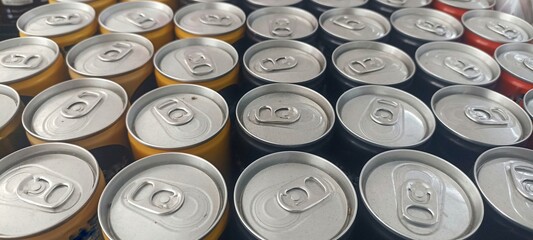 close up of a group of aluminium cans. Group of aluminum cans with beer or soda. Many aluminium...