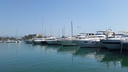 Moored boats in port Vauban with Fort Carre in Antibes, France