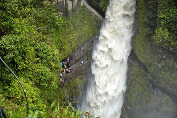 Tourists on a trail behind the Pailon del Diablo waterfall in Banos, Ecuador