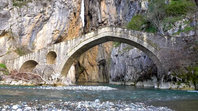 Static Shot of Portitsa Stone Bridge and Canyon in Grevena Greece. Waters Flow in The River. Greek Mountains