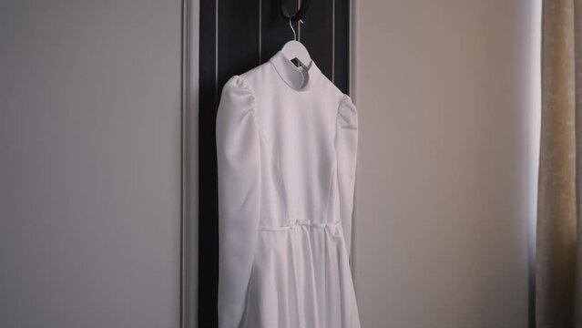 Hanging white wedding dress, smooth gimbal shot, bride event, bridal design, Slow motion Full HD