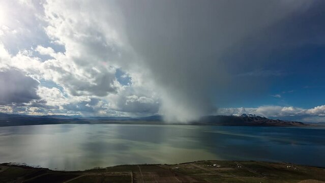Timelapse of clouds rolling over Utah Lake moving towards the camera.