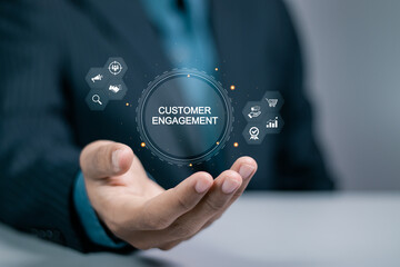 Customer engagement concept. Target customer, buyer persona and customer behavior. Businessman holding customer engagement icon on virtual screen.