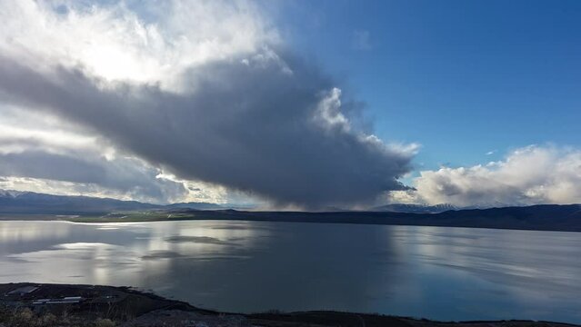 Timelapse of low storm clouds moving over Utah Lake as it lightly drops moisture.