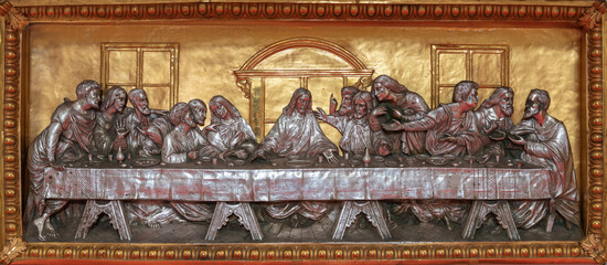 MILAN, ITALY - MARCH 6, 2024: The metal gilded and silver plated relief of Last supper on the menza of church Chiesa di Santa Maira del Carmine by local artist from end of 19. cent.