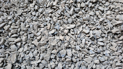 Gravel texture or gravel background for design. Real grunge texture background and small stone.Top view of ground gravel road. selective focus.