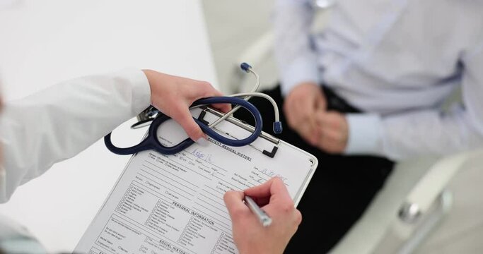 Doctor fills questionnaire before prescribe treatment for patient