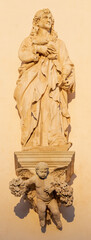 Vicenza - The statue of St. John the Apostle on the facade of church Santuario Santa Maria di Monte Berico in the evening light (1688 - ca 1707).