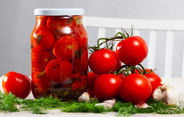 Marinated tomatoes in glass jar, preserved or canned food - 770263110