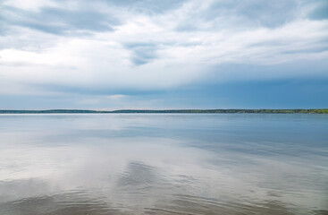 Blue lake with cloudy sky, natural background