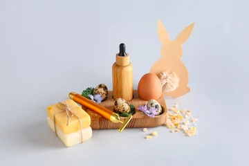 Poster Composition with spa supplies and Easter decor on grey background © Pixel-Shot