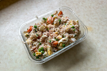 Homemade rice salad with vegetables and tuna