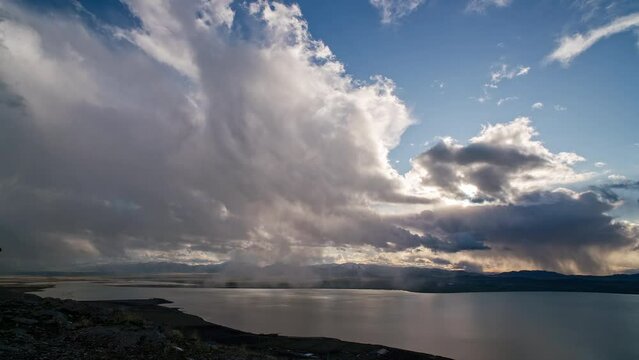 Timelapse overlooking Utah Lake as light storms move through the landscape.