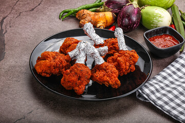 Indian cuisine glazed chicken lollipop