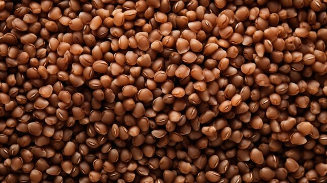 A close up of a pile of brown beans. The beans are scattered all over the image, creating a sense of depth and texture. The image conveys a feeling of abundance and richness